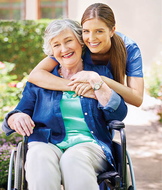 Shot of a resident and a nurse outside in the retirement home garden